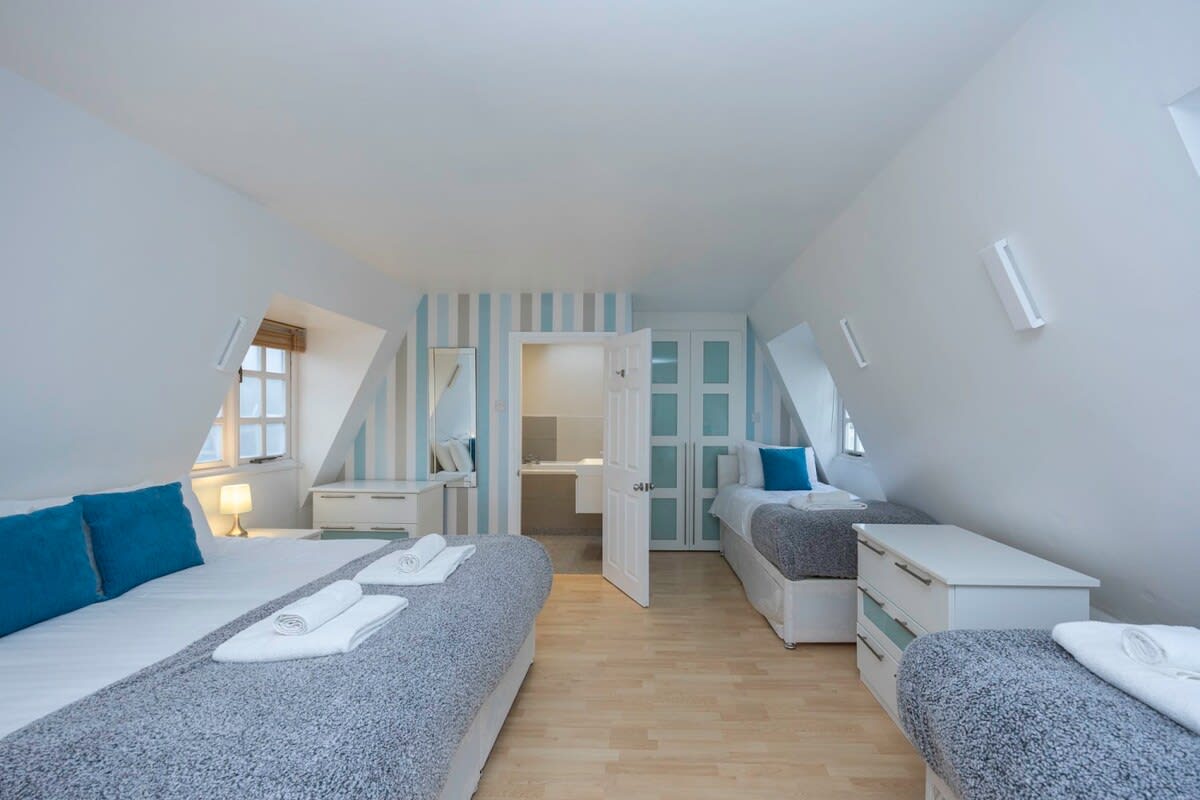 The loft room has a double bed and 2 singles, each of the singles has an additional trundle single - sleeps 6 in total.