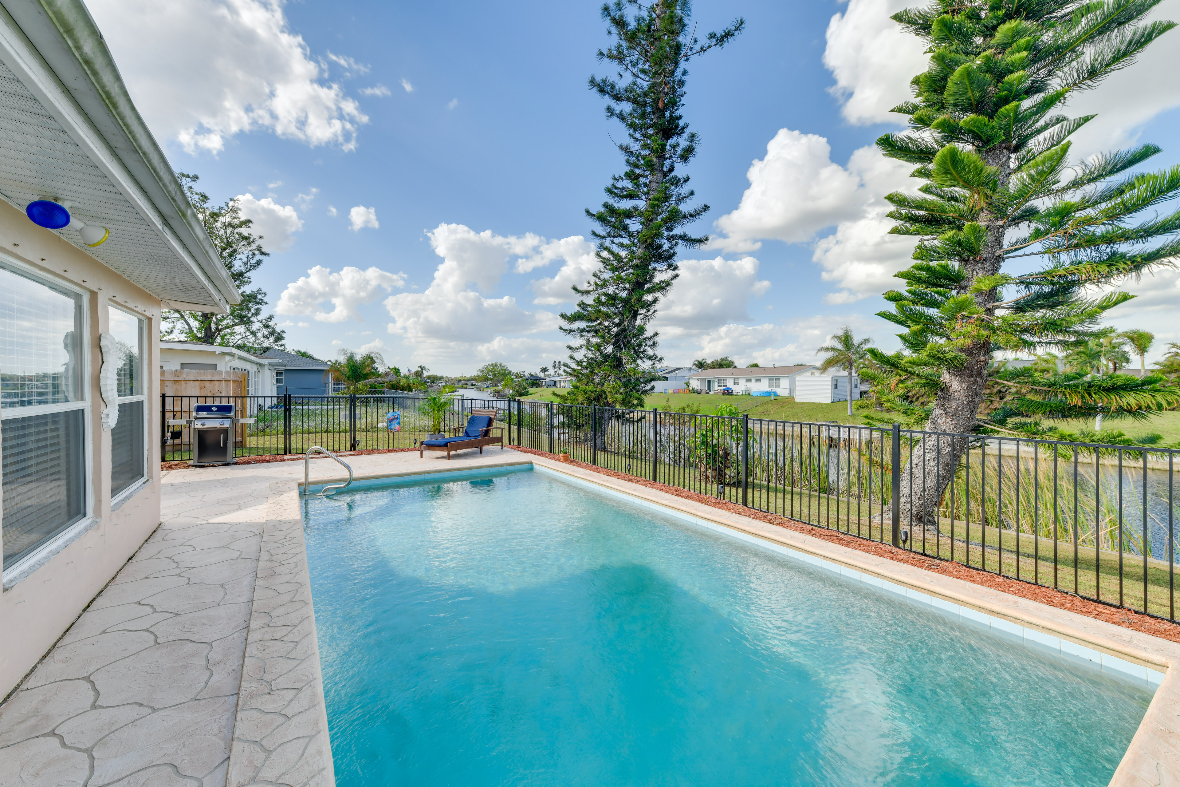 Property Image 1 - Canal-Front Pool & Fire Pit Table: North Port Home