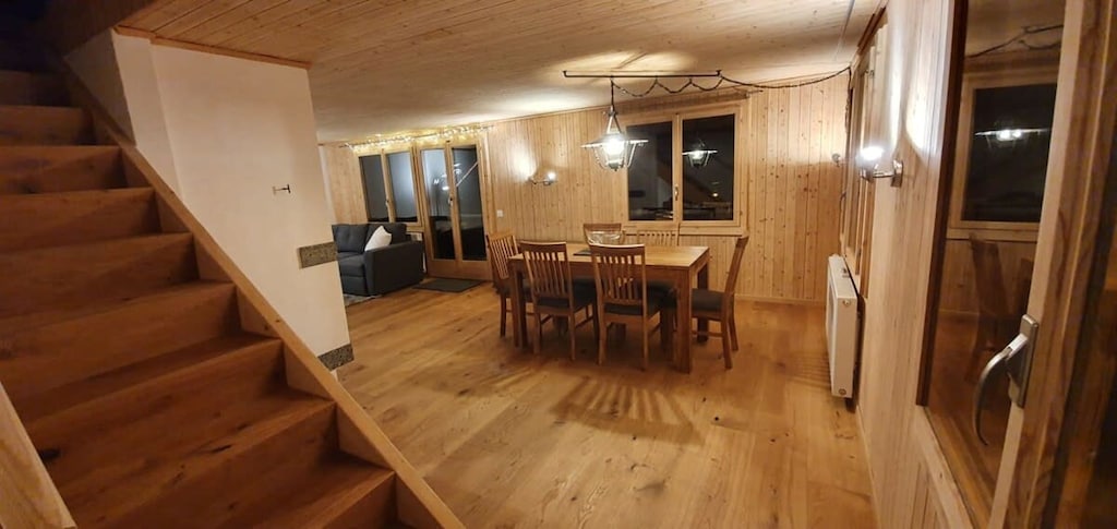 overview of the living space by the staircase going up to the bedrooms 