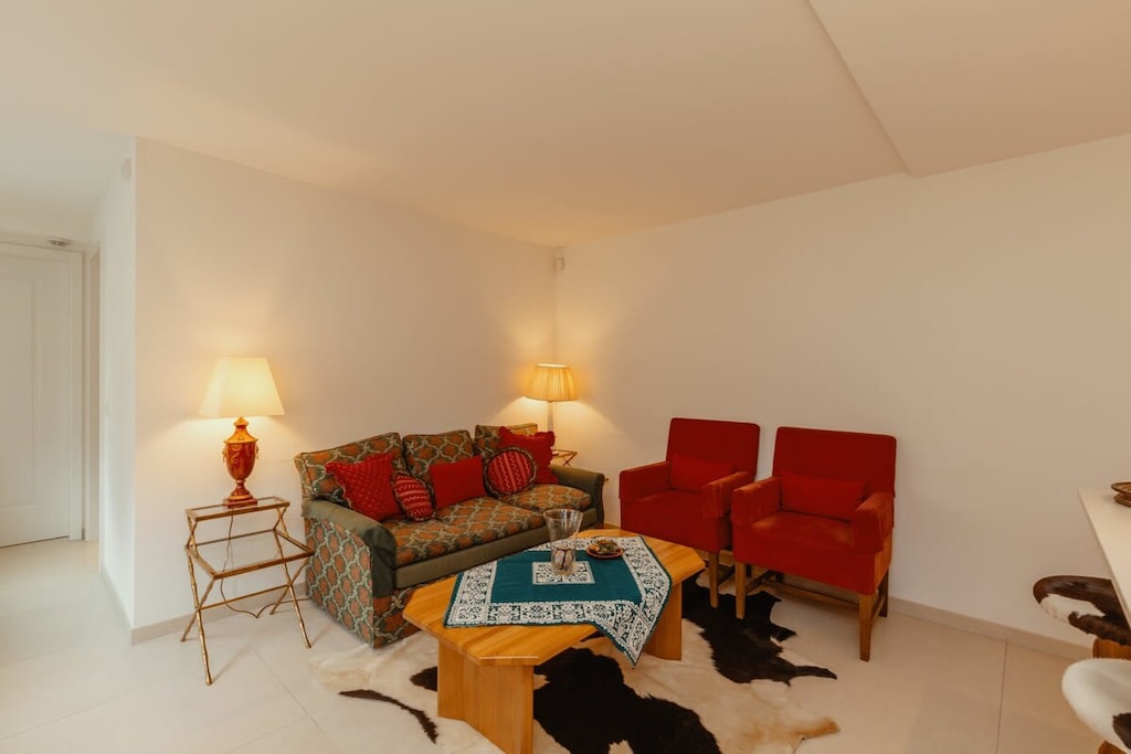 living room sitting area in front of the kitchen 