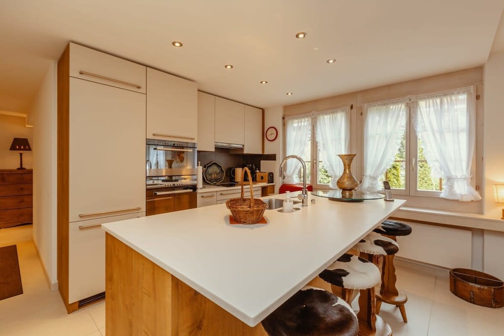 charming kitchen with island bar 
