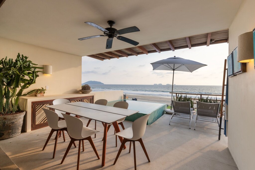 Experience breathtaking sunsets while dining on this oceanfront terrace, designed for relaxation and entertaining.