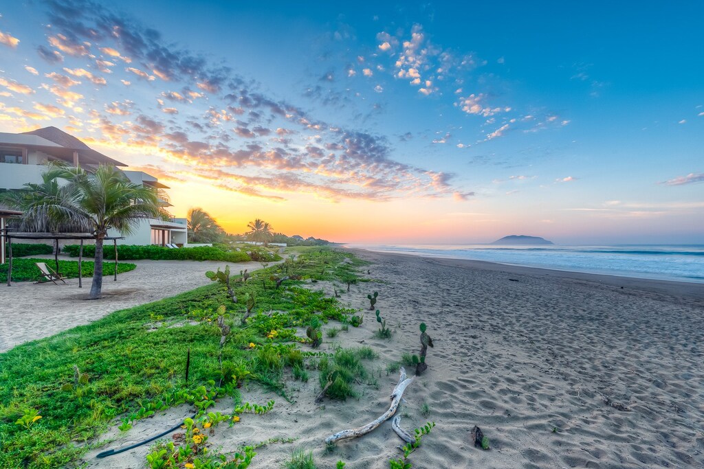 Surrounded by lush coastal greenery, this untouched stretch of paradise offers direct beach access and peaceful morning walks.