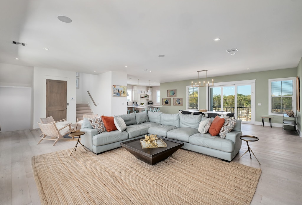 The living room has a large couch and an additional seating area.