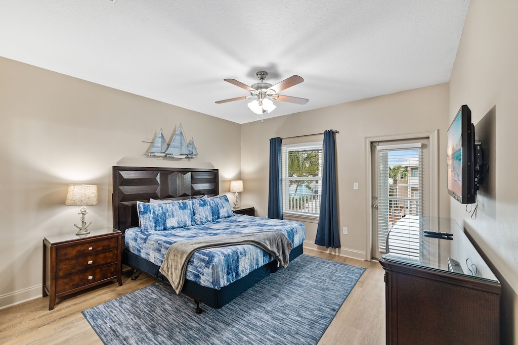 2nd floor elegant Bedroom #4 with a king bed has a mounted flat-screen TV.