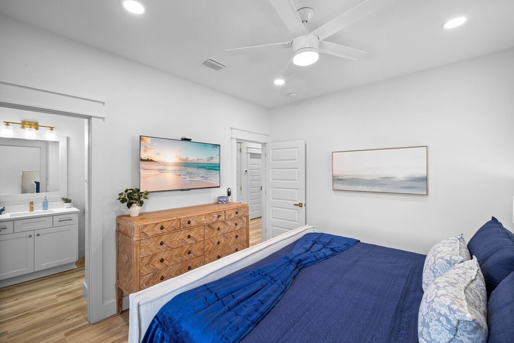 Bedroom #6 includes a mounted flat-screen TV.