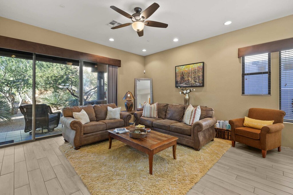 Inviting living room with comfortable seating, natural light, and access to the outdoor patio