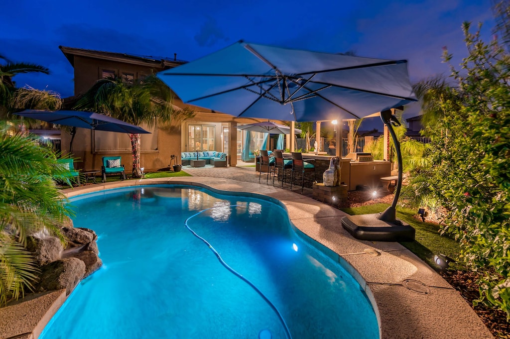 The perfect evening escape—our heated pool glows softly, creating a magical nighttime ambiance."