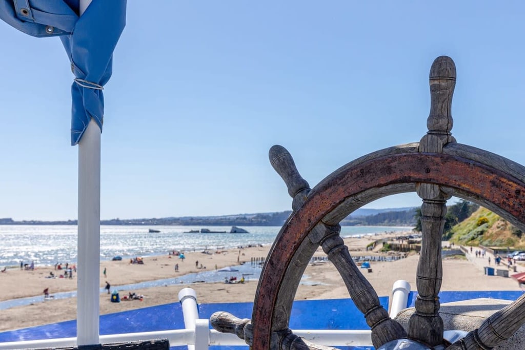 Welcome aboard! This unique beachfront house is designed to look like a boat, complete with porthole windows and a ships wheel.