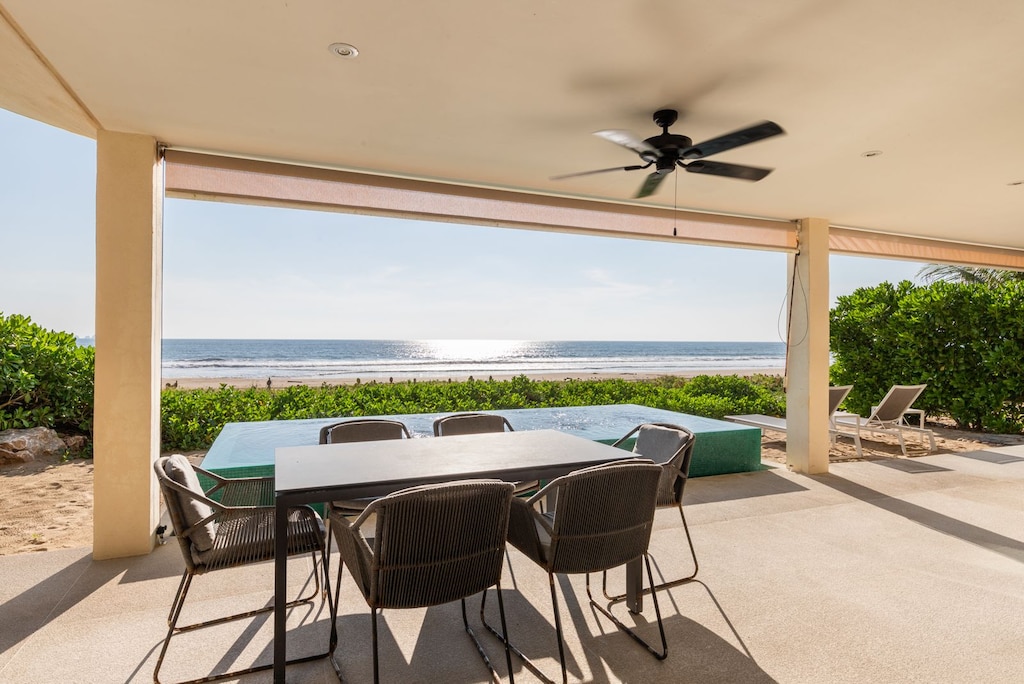 Dine in comfort with panoramic ocean views, a shaded pergola, and a stylish dining area perfect for gatherings.