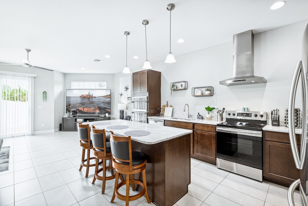Open layout, island seating & top-notch appliances.
