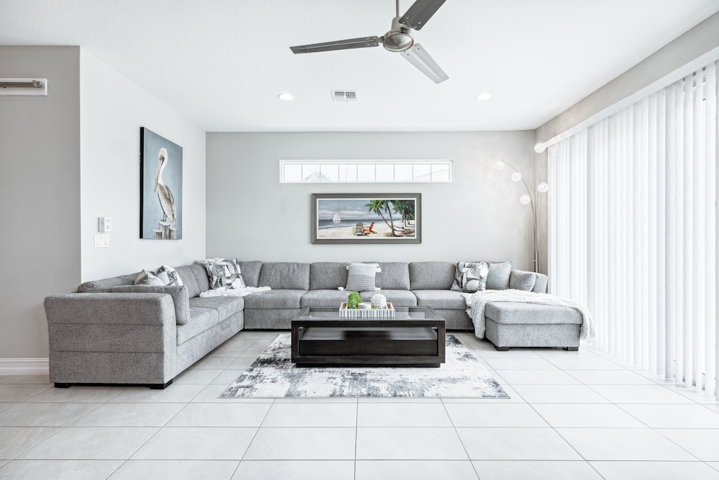 Unwind in this bright, open living room with a cozy sectional.