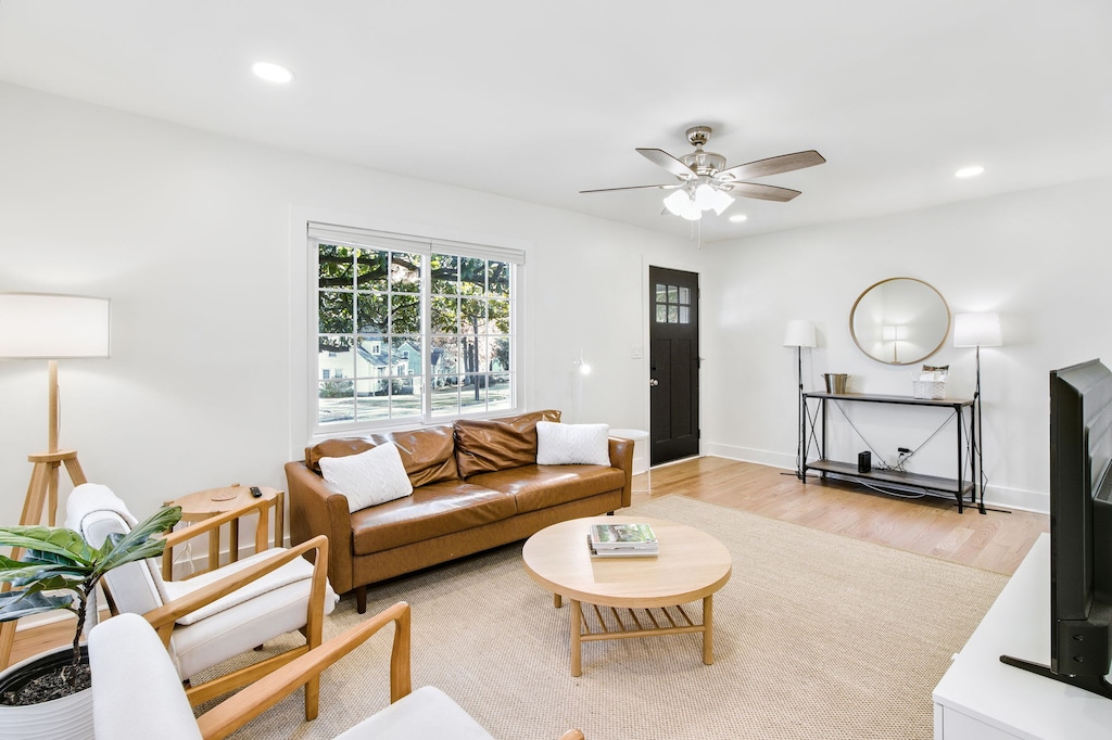 Bright and inviting living room with stylish decor and ample natural light, perfect for relaxing or entertaining.