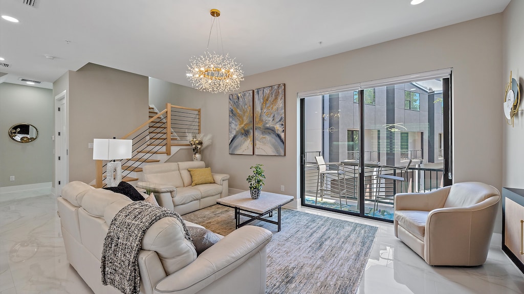 Soak up the natural light in the living room, which opens directly to a private balcony for seamless indoor-outdoor living.