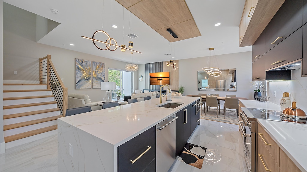 Create memorable meals in the stunning gourmet kitchen, featuring a massive waterfall island and state-of-the-art appliances.
