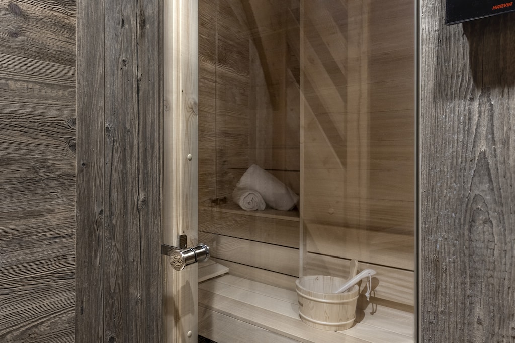 Enjoy a private sauna at Ferme des Tétras, Bionnassay, during your luxury stay in Saint-Gervais-les-Bains. After a day on the slopes or hiking, unwind in this cosy wooden wellness area, the perfect alpine retreat for relaxation.