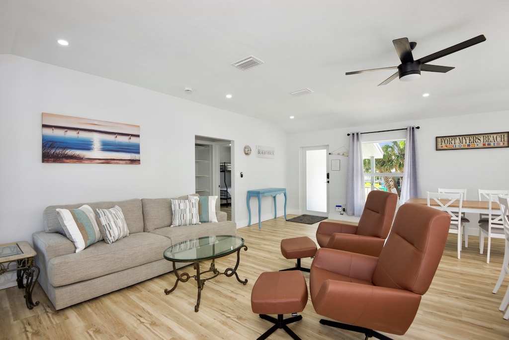 Entrance leading to living room with recliner chair