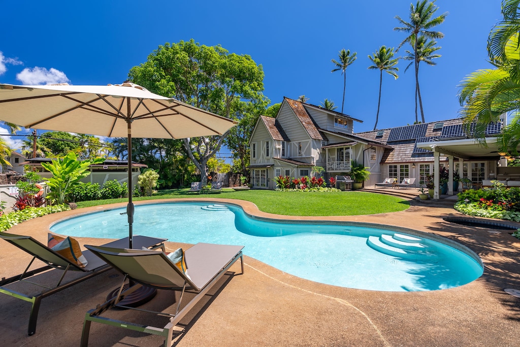 Beautiful garden featuring a private spa surrounded by tropical plants for a tranquil escape.