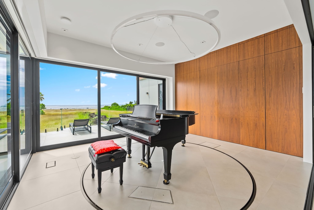 The music room's baby grand is a visual showpiece—refined design for those who appreciate rhythm and elegance.