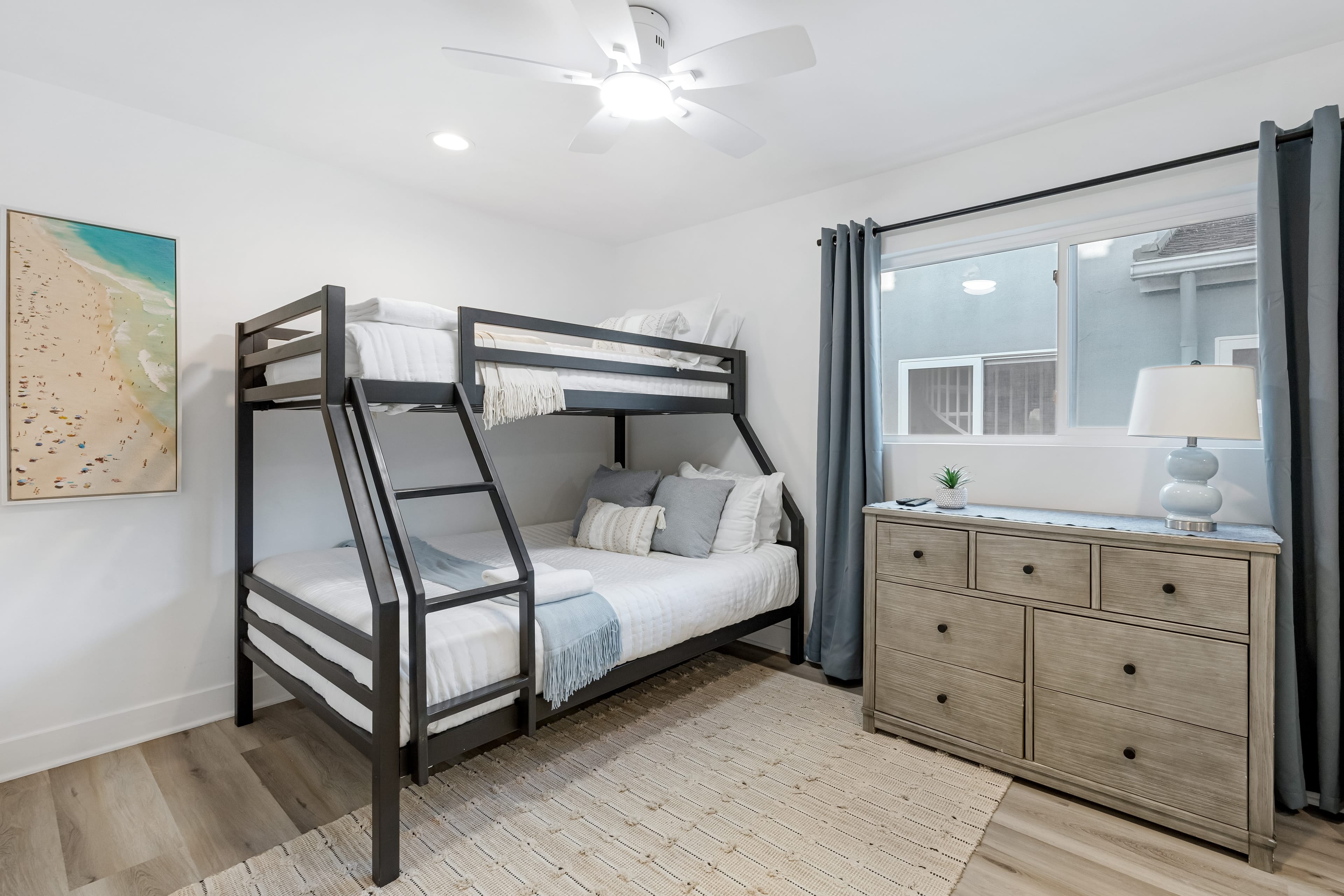 Bedroom 4 features a twin-over-full bunk bed and a TV.