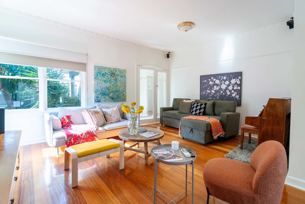 North facing lounge room with comfy sofa bed and seats