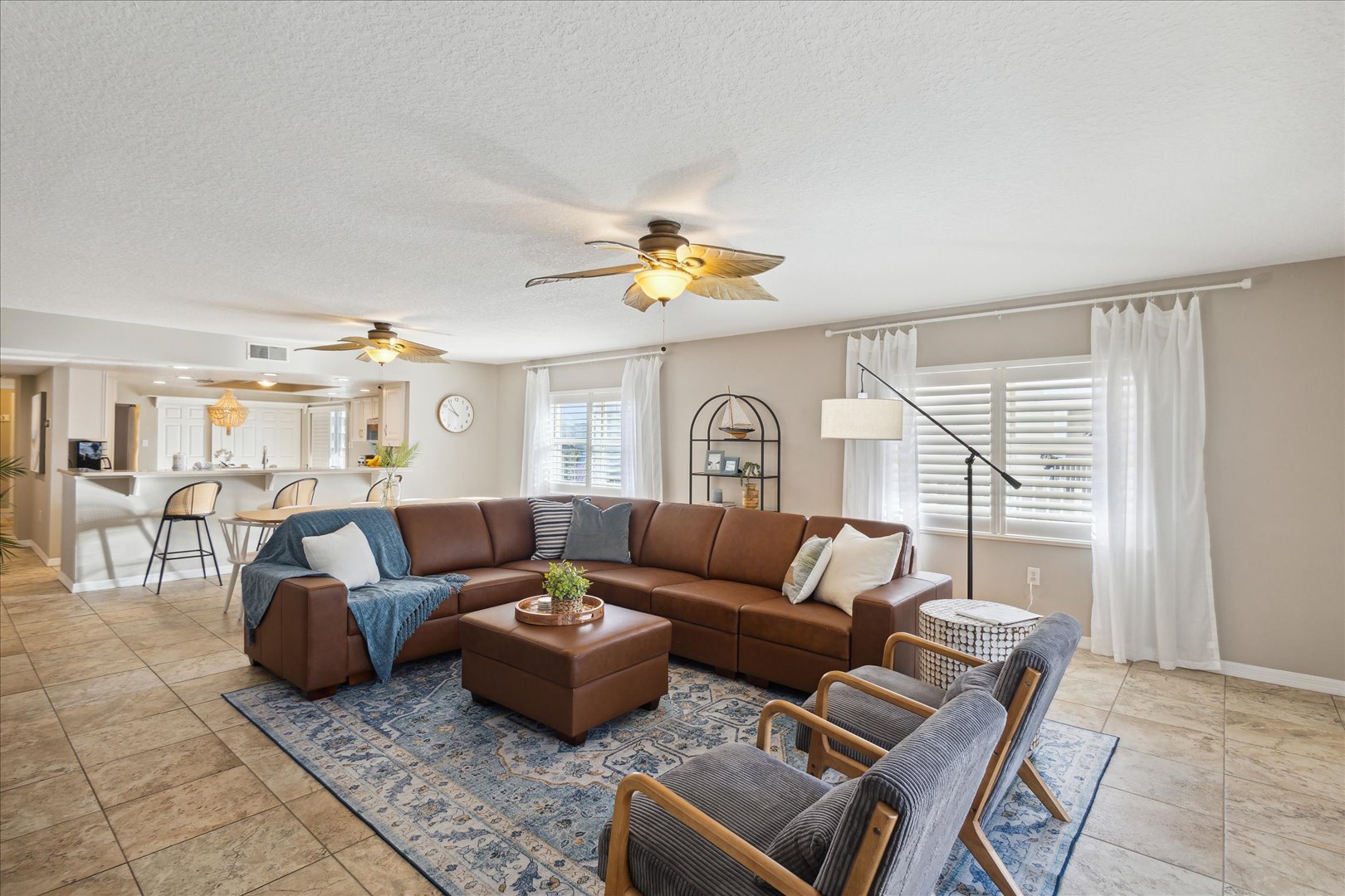 More seating to this living area to gather, filled with natural light during the day