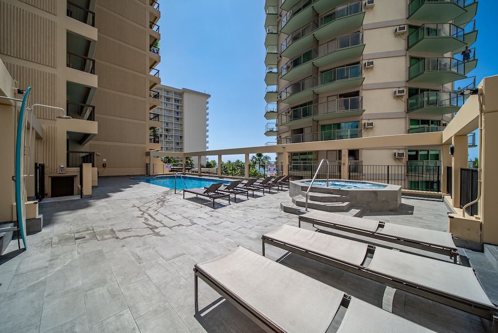 Spacious sundeck with lounge chairs, perfect for soaking up the Hawaiian sun in a resort-style setting.
