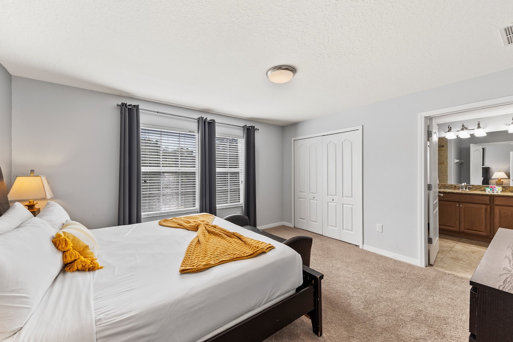 Bedroom 2 with a king size bed and a private bathroom