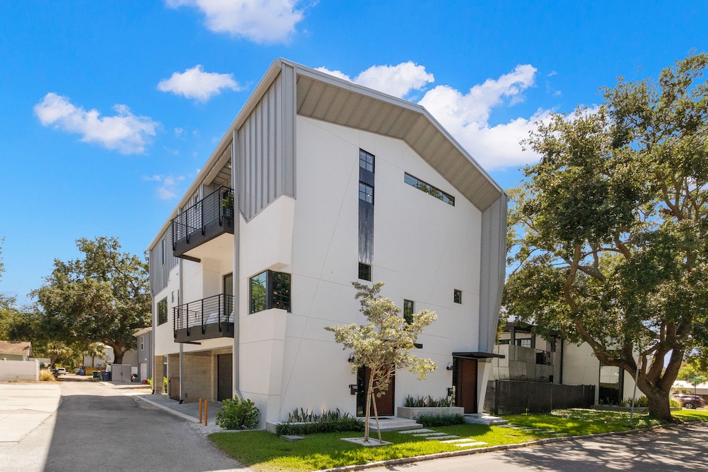 Nestled on a quiet street, this elegant residence stands out with its sculptural details and serene surroundings.
