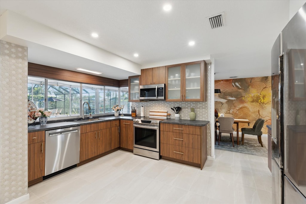 The cabinets are stocked with cookware, dishes, glassware, and utensils for your meal prep