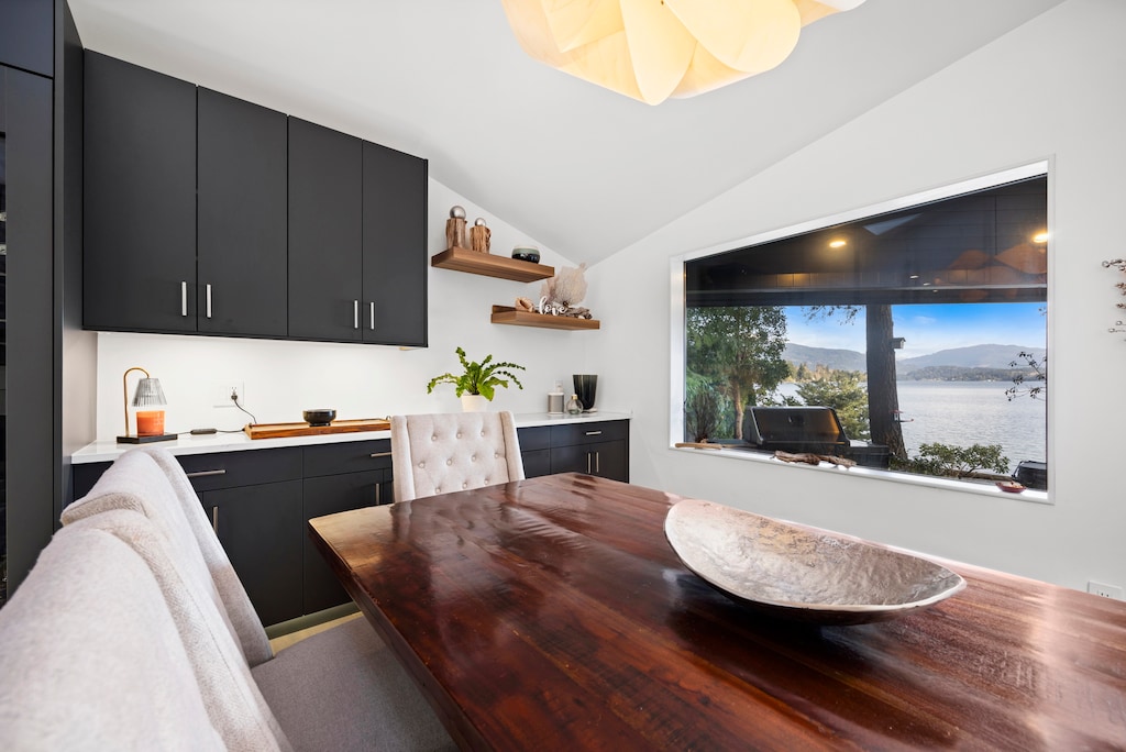 Stylish and intimate, this cozy corner invites leisurely meals or a quiet workspace with a view.