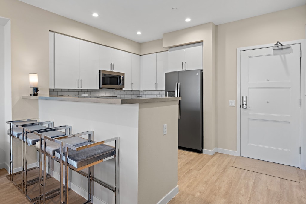 Four additional bar stools are available for a quick snack or for younger kids