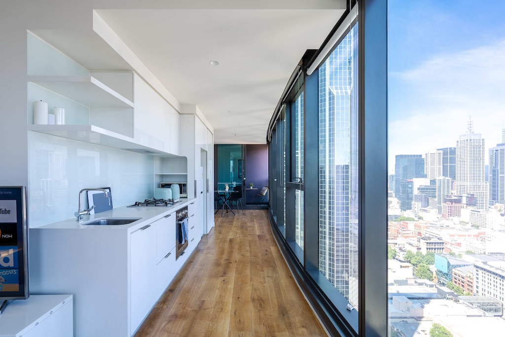 Modern, open-plan kitchen with expansive city views