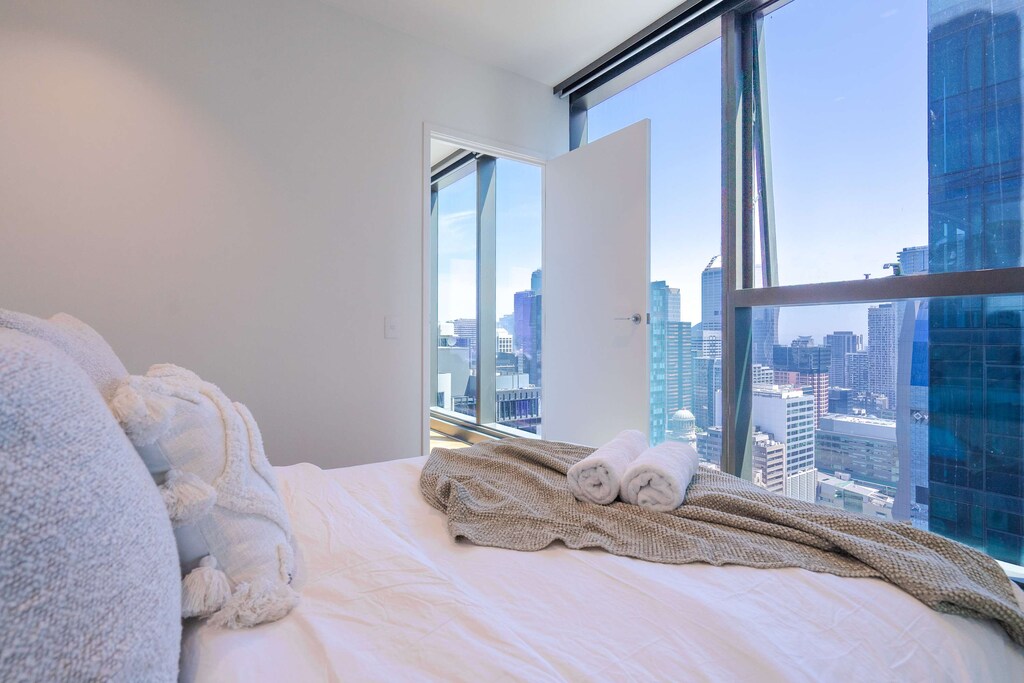 Bedroom with panoramic city views