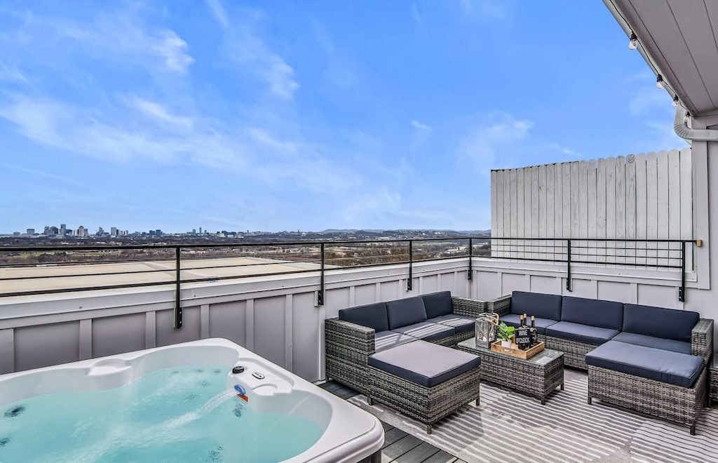Sip drinks by the hot tub while soaking in stunning Nashville skyline views!