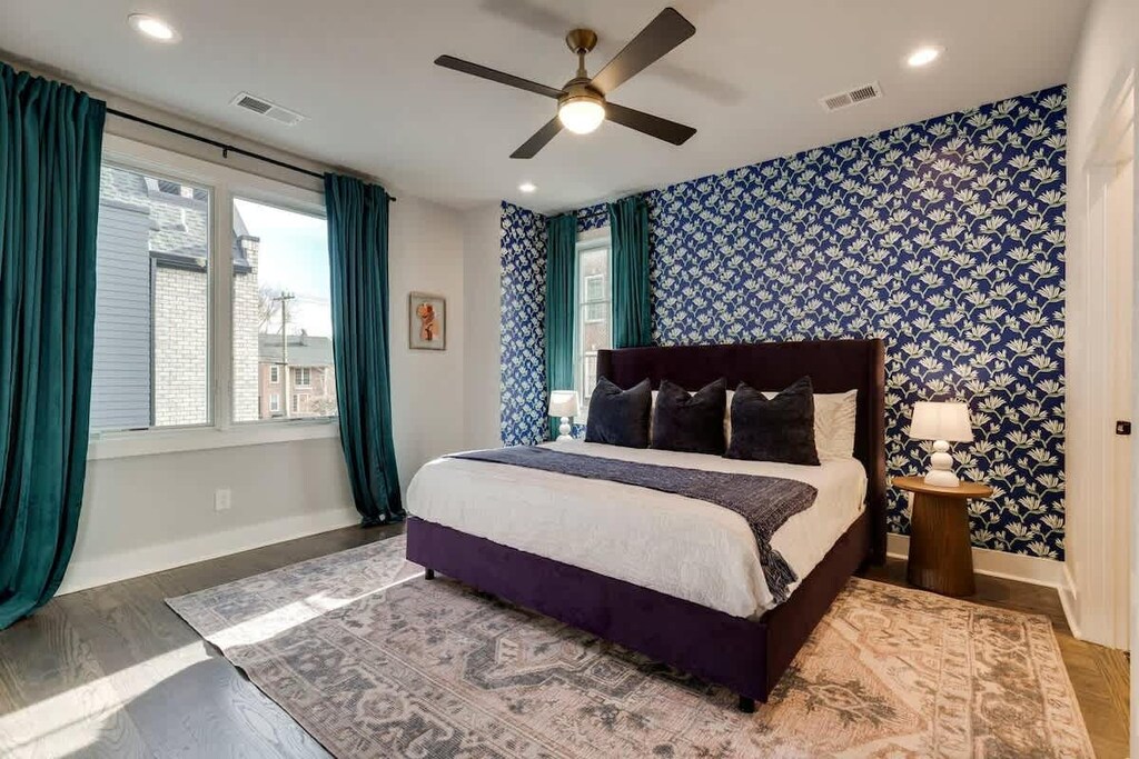 Stylish Master Bedroom with king sized bed, huge walk-in closet, attached bathroom with massive walk-in shower. 