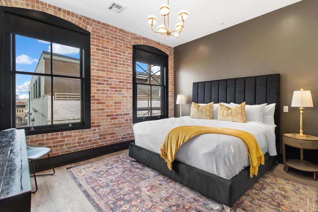 Retreat to the Primary bedroom with a plush king bed, walk-in closet, blackout shades, and a smart TV. Designed for comfort and privacy, this suite is perfect for recharging after a day exploring New Orleans.