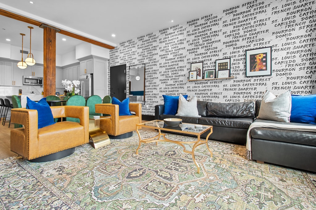 Relax in the living area with a smart TV, stylish seating, and a sleeper sofa for extra guests. Perfect for families or group stays in New Orleans, this inviting space is ideal for movie nights or recharging after a day in the city.