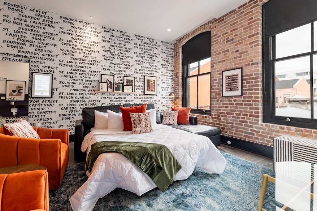 Relax in the living area with a smart TV, stylish seating, and a queen-sized sleeper sofa for extra guests. Perfect for families or group stays in New Orleans, this inviting space is ideal for movie nights or recharging after a day in the city.