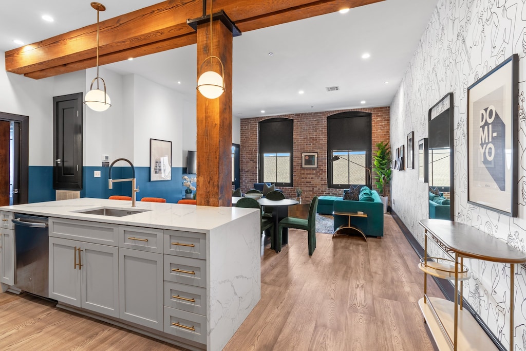 Cook or snack in style with a full kitchen featuring GE stainless appliances, cookware, and an island with bar seating. Ideal for short or extended stays, our kitchens make group travel in New Orleans easy and comfortable.