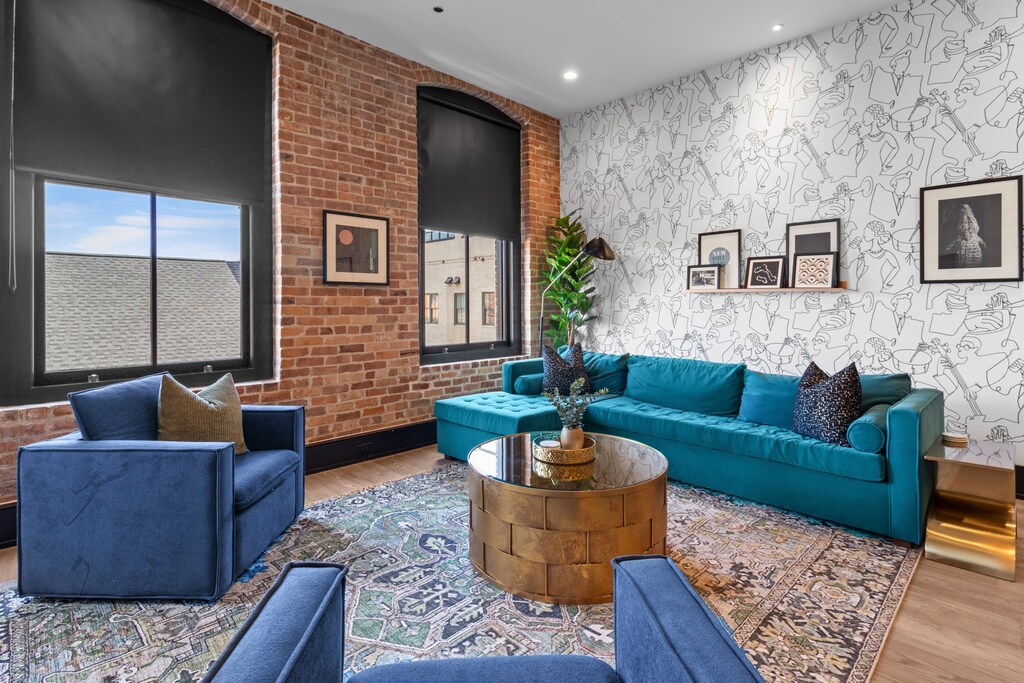 Relax in the living area with a smart TV, stylish seating, and a sleeper sofa for extra guests. Perfect for families or group stays in New Orleans, this inviting space is ideal for movie nights or recharging after a day in the city.