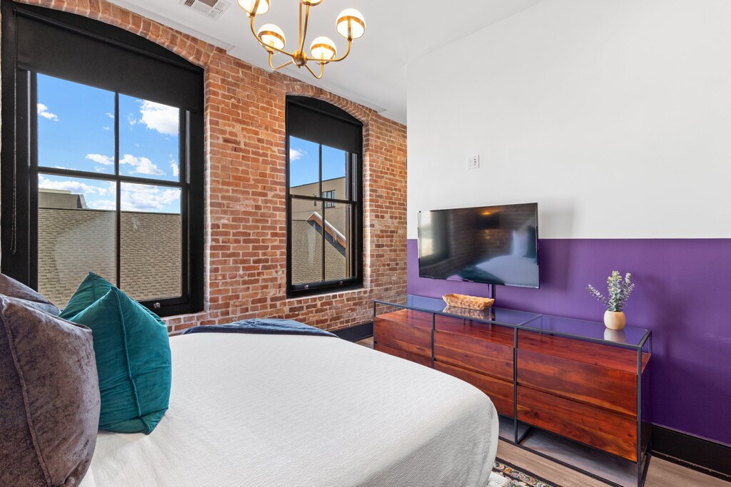 Retreat to the Primary bedroom with a plush king bed, walk-in closet, blackout shades, and a smart TV. Designed for comfort and privacy, this suite is perfect for recharging after a day exploring New Orleans.