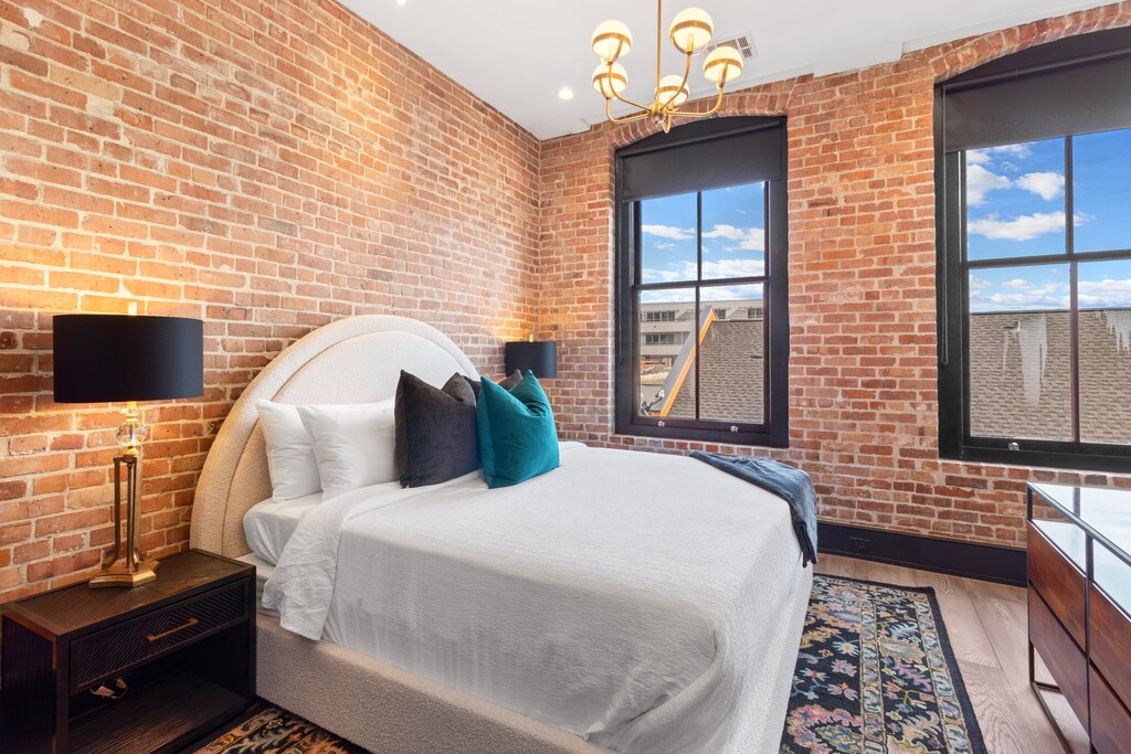 Retreat to the Primary bedroom with a plush king bed, walk-in closet, blackout shades, and a smart TV. Designed for comfort and privacy, this suite is perfect for recharging after a day exploring New Orleans.