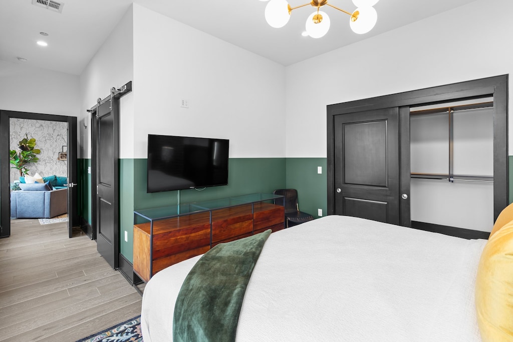 Retreat to the Primary bedroom with a plush king bed, walk-in closet, blackout shades, and a smart TV. Designed for comfort and privacy, this suite is perfect for recharging after a day exploring New Orleans.