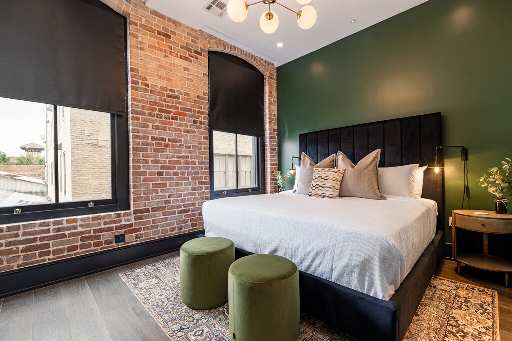 Retreat to the Primary bedroom with a plush king bed, walk-in closet, blackout shades, and a smart TV. Designed for comfort and privacy, this suite is perfect for recharging after a day exploring New Orleans.