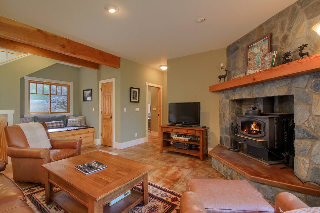 A wood stove in the living room and radiant floor heaters ensure you will stay cozy even in the coldest of weather.