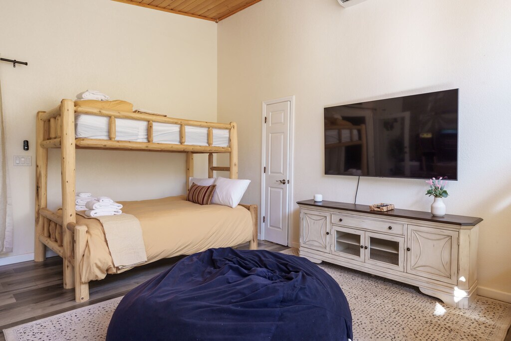 One of two bunk beds that has a twin on top and a full on the bottom in The Gathering Room