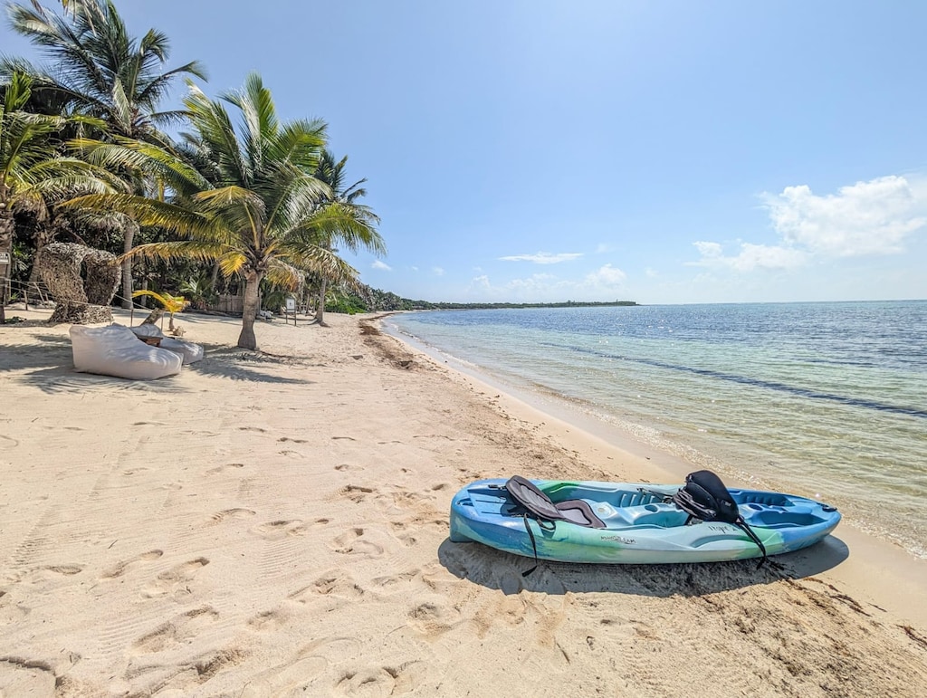 A serene view of soft sand and turquoise sea 
