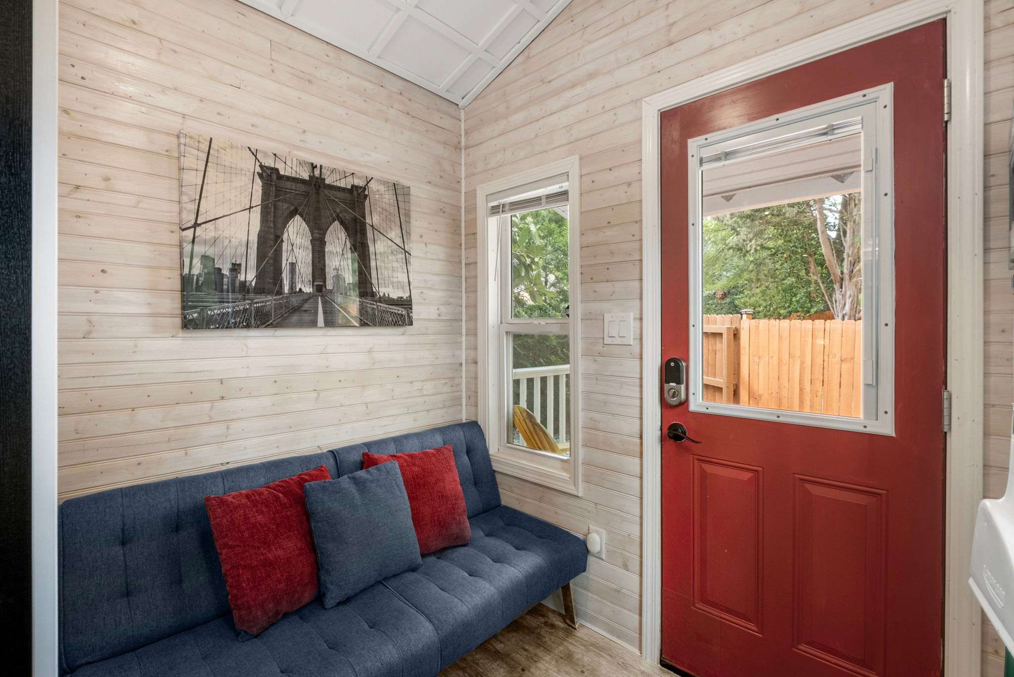 Charming nook with a stylish futon and vibrant decor, perfect for unwinding after a day of exploring.