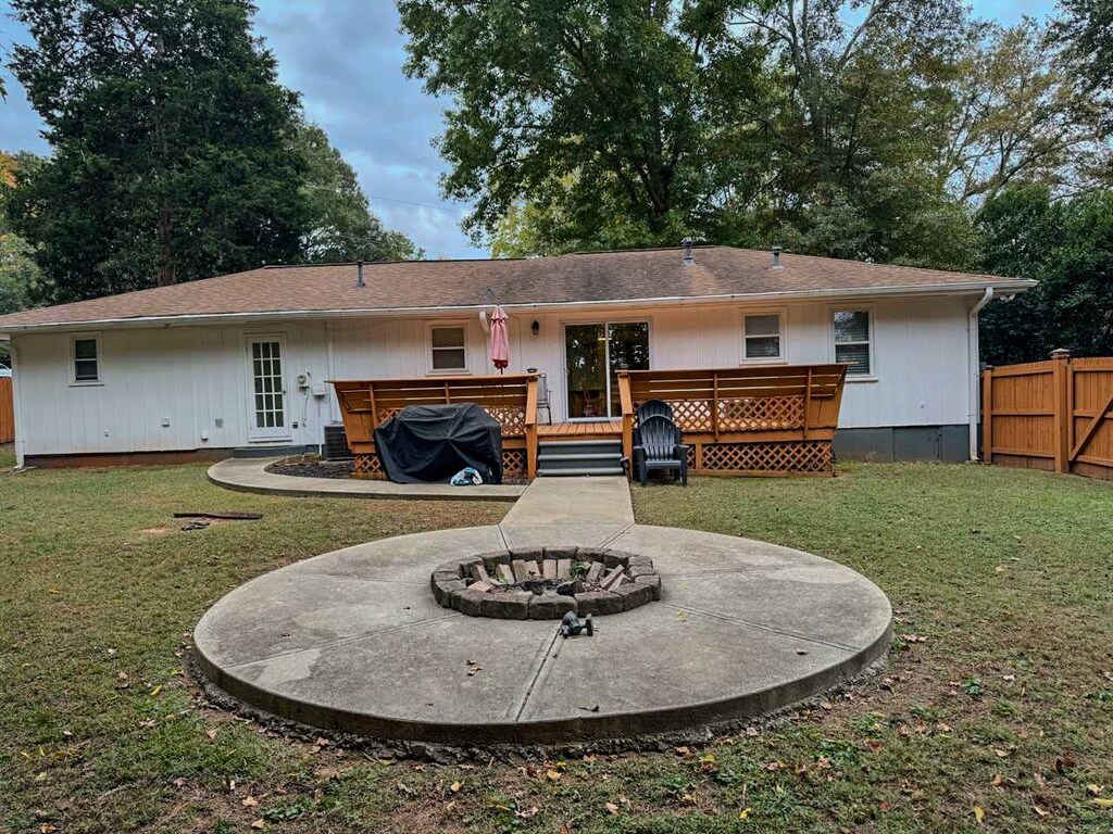 Enjoy cozy evenings around the fire pit in this inviting backyard retreat, perfect for gatherings under the stars.